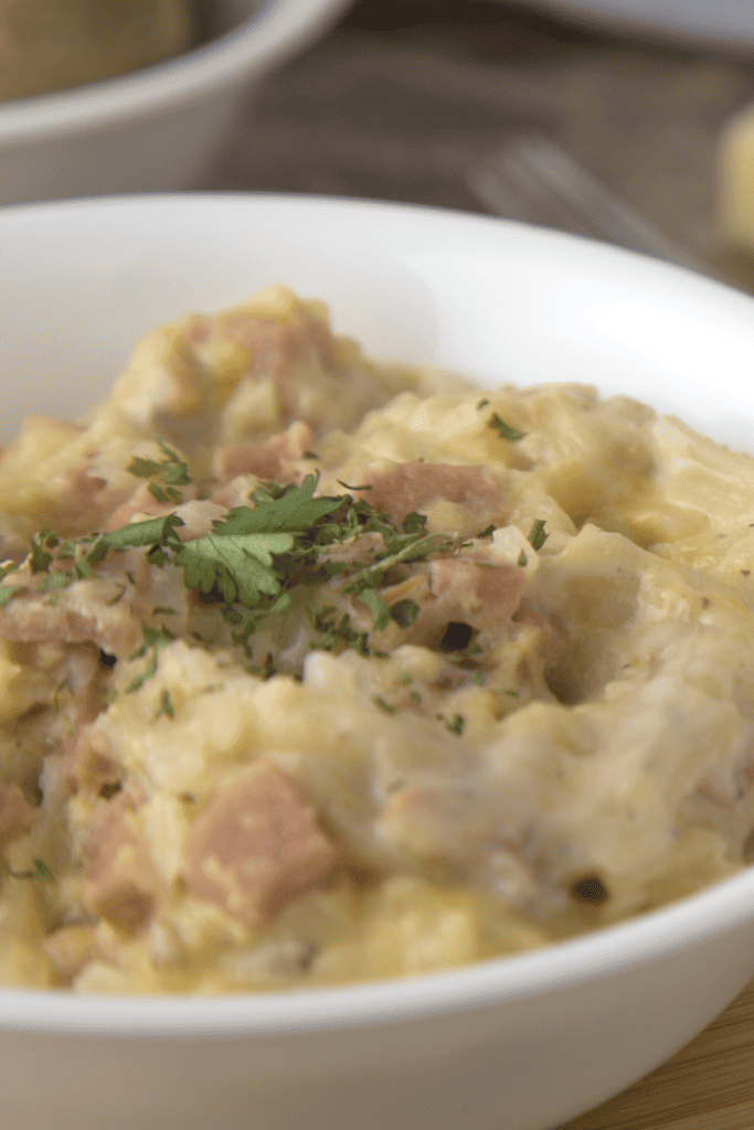 Cheesy Spam Hash Brown Casserole served in white bowl