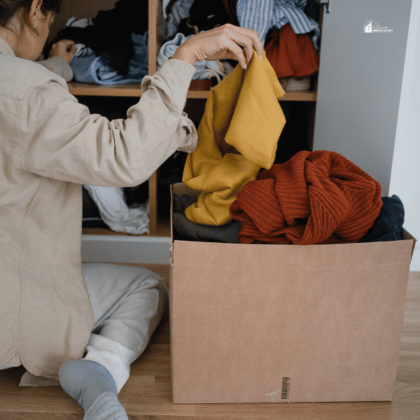Woman Decluttering Clothes