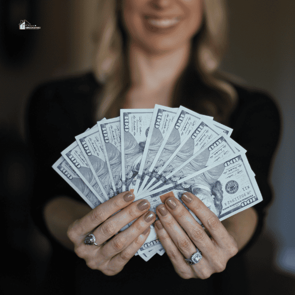 woman holding a few cash