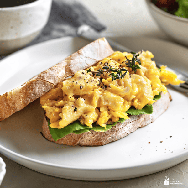 An image of scrambled eggs on toast.