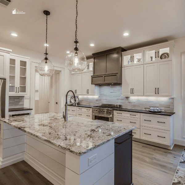 countertop and two pendant lights above island