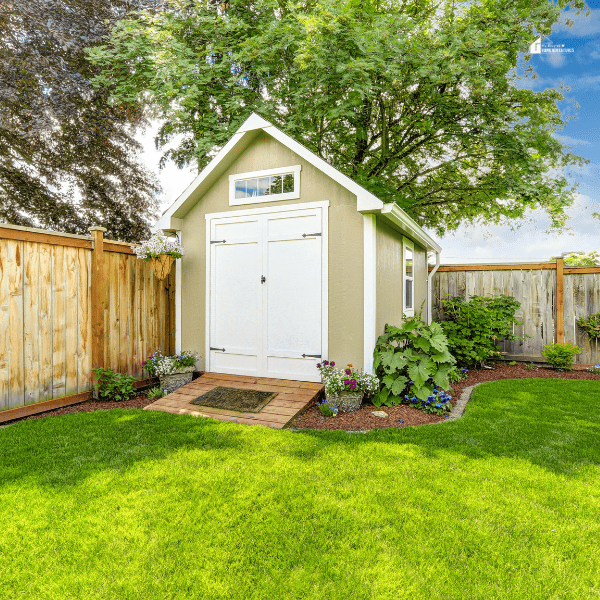 Fenced backyard with small shed