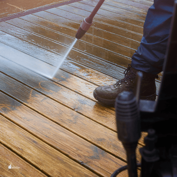 man cleaning a deck