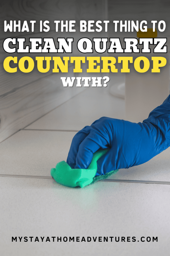 a hand cleaning a countertop with text: "What is The Best Thing To Clean Quartz Countertops With"