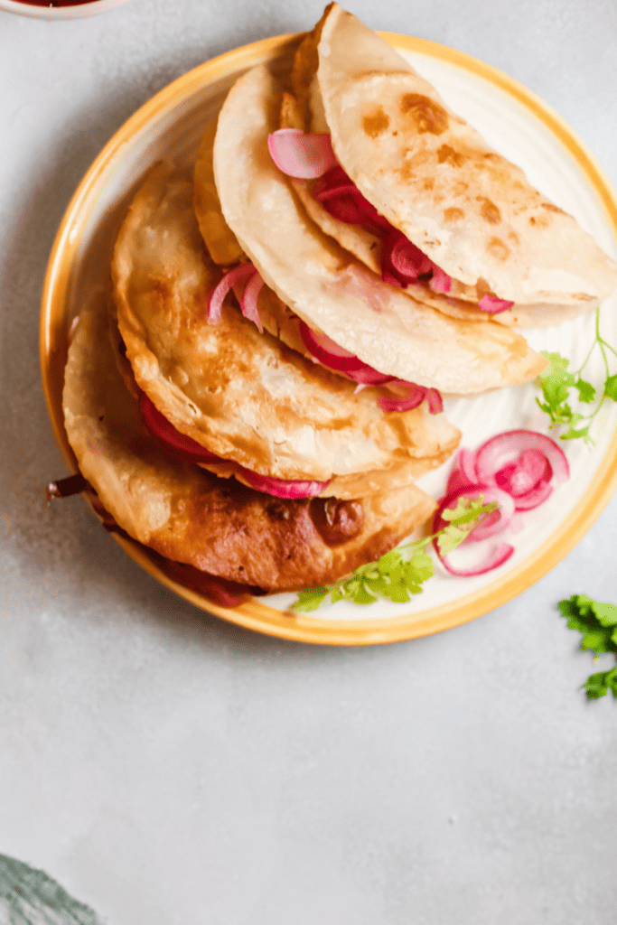 Top view of served tacos de papas