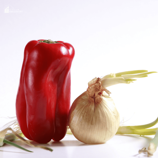 An image of an onion and a bell pepper.