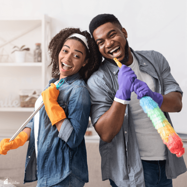 an image of couple happily doing some cleaning