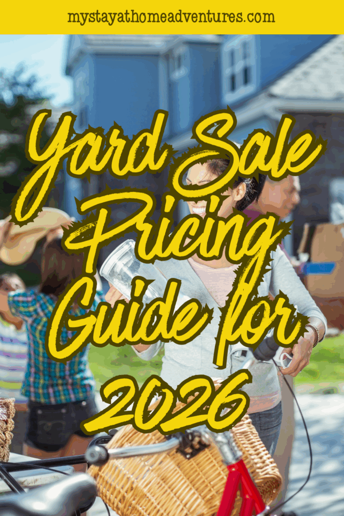 A cheerful woman holding items to sell outside her home, with people shopping in the background during a sunny yard sale.