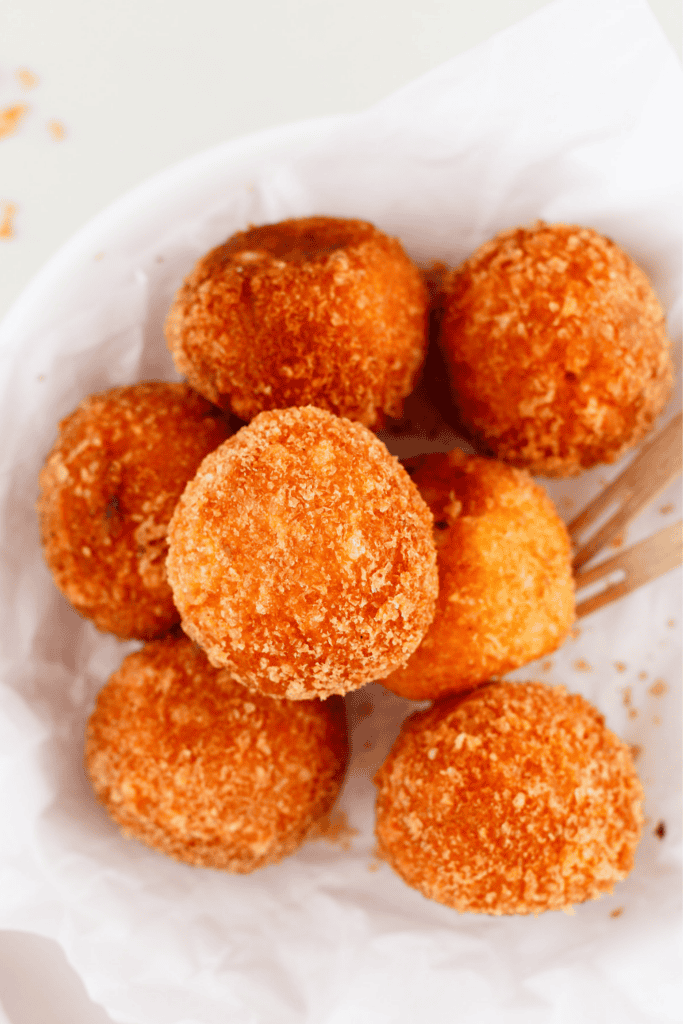 Golden Puerto Rican cheese balls with a crispy breadcrumb coating, served hot as an easy appetizer or snack.