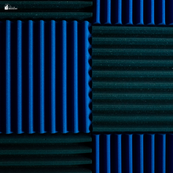Close-up of blue and black acoustic foam panels arranged in alternating directions for soundproofing.