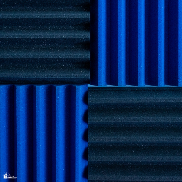 A close-up of textured blue and black acoustic foam panels designed for reducing indoor noise and echo.