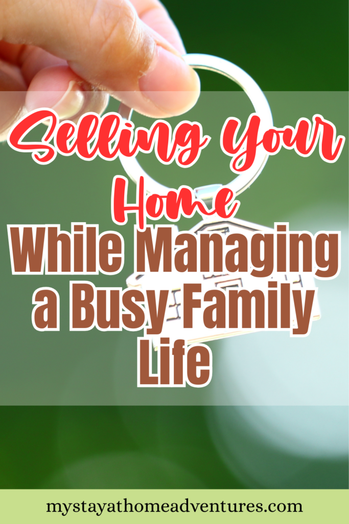 A close-up of a hand holding a house-shaped keychain, symbolizing homeownership and the process of selling a home while managing family responsibilities.