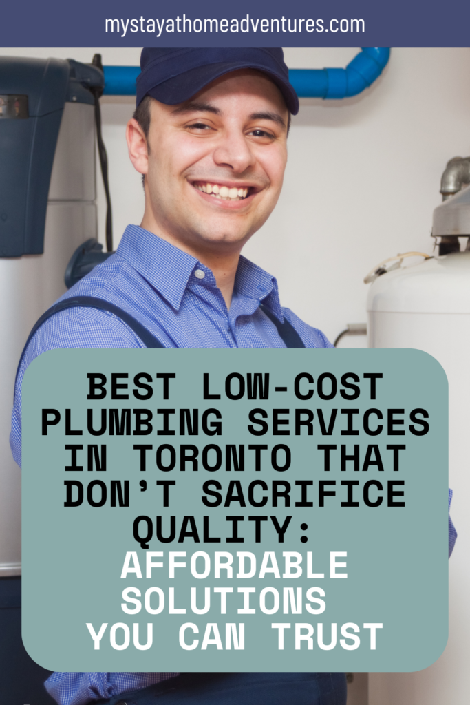 A smiling plumber in a blue uniform stands beside a water heater and pipes, ready to provide professional plumbing service.