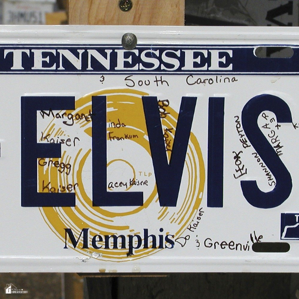 A novelty Tennessee license plate customized with handwritten names and bold ELVIS text, representing the personal flair of private plates.