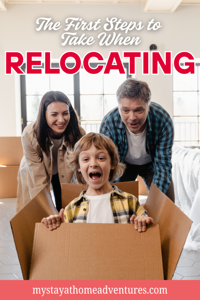 A happy child plays inside a moving box while parents smile during a home relocation.