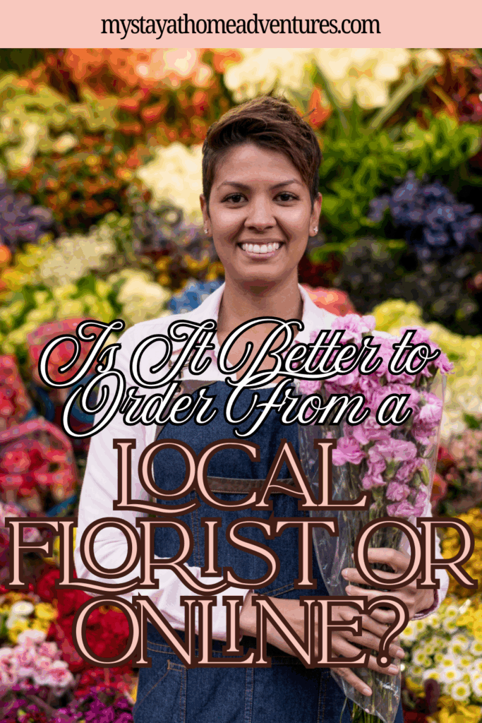 A woman holding a bouquet of flowers while standing in front of colorful floral displays.