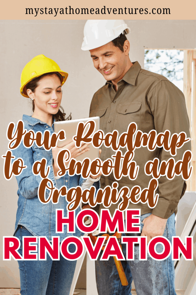 Two people wearing safety helmets reviewing renovation plans on a tablet inside a partially finished home.