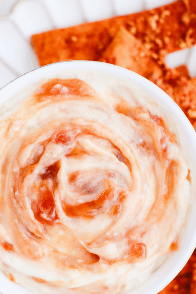 Creamy Puerto Rican guava dip swirled in a white bowl, a tropical Caribbean appetizer perfect for parties and served with crispy chips.