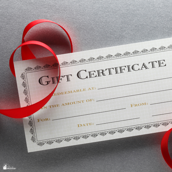 A blank gift certificate with decorative borders and a red ribbon on a gray background.