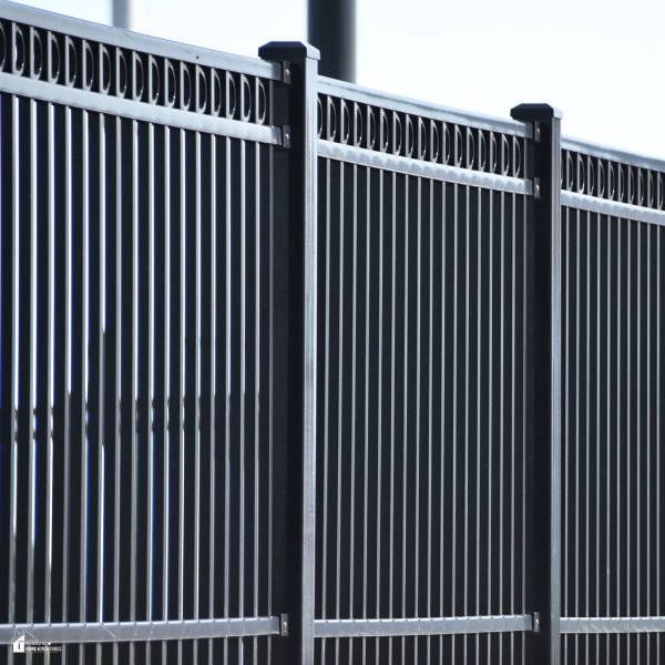 Sleek black WPC fencing with vertical slats offers a modern, sustainable design option for residential spaces.