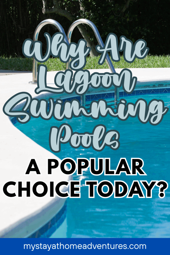 A close-up of a backyard lagoon pool with shimmering blue water and a pool ladder on the deck.