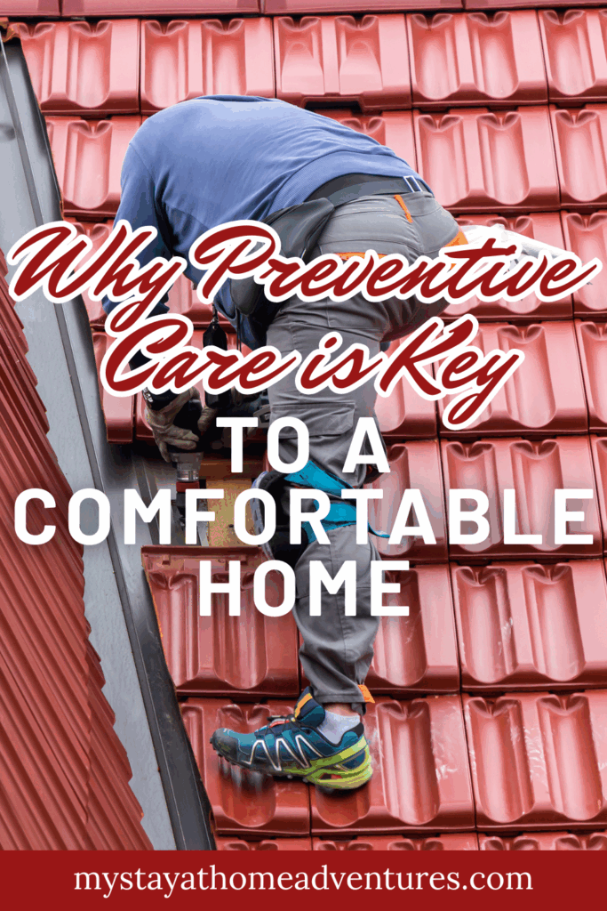 A worker in protective gear performs roof maintenance on a red tile roof to prevent home damage and ensure structural safety.