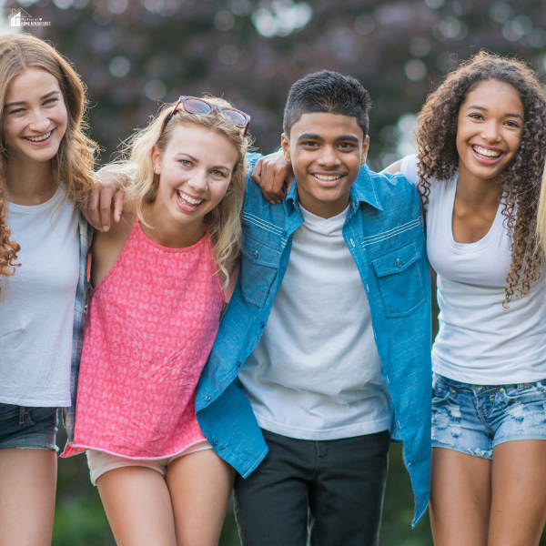 A group of teens smiling together, representing youth exploring creative career paths.
