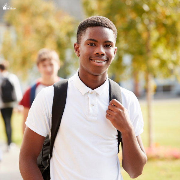 A teen boy walking confidently, symbolizing independence and future career exploration.