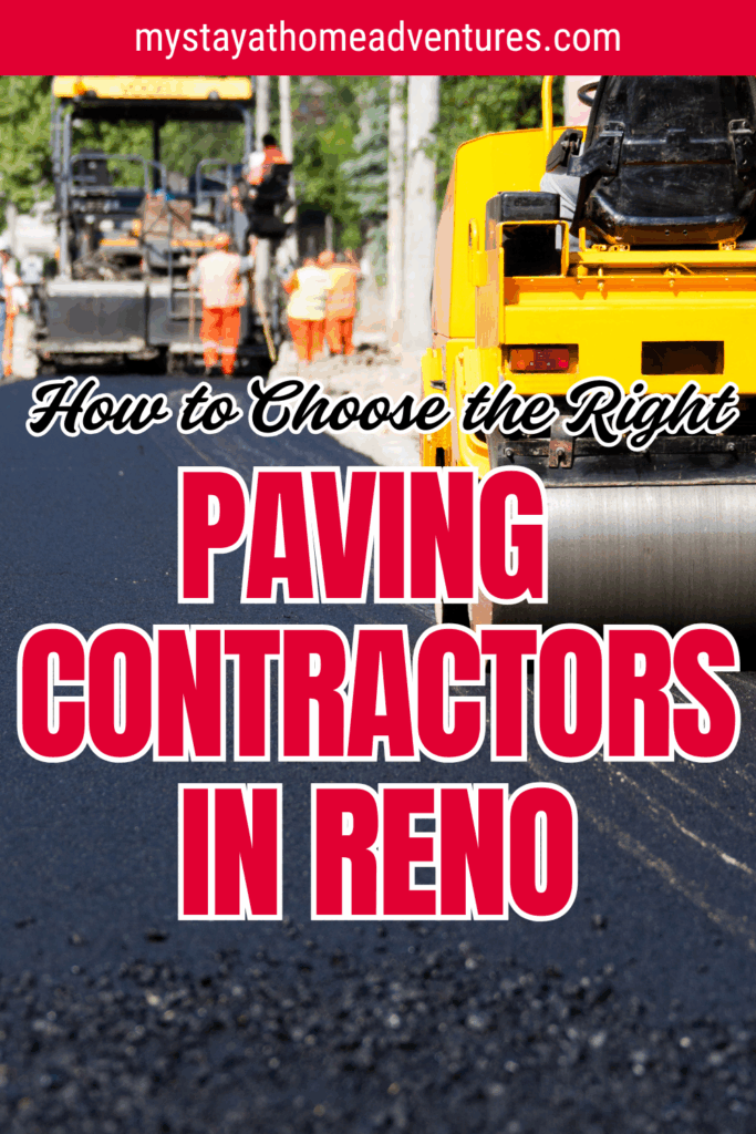 A yellow steamroller finishes smoothing and paving a fresh asphalt road while other workers and equipment operate in the background.
