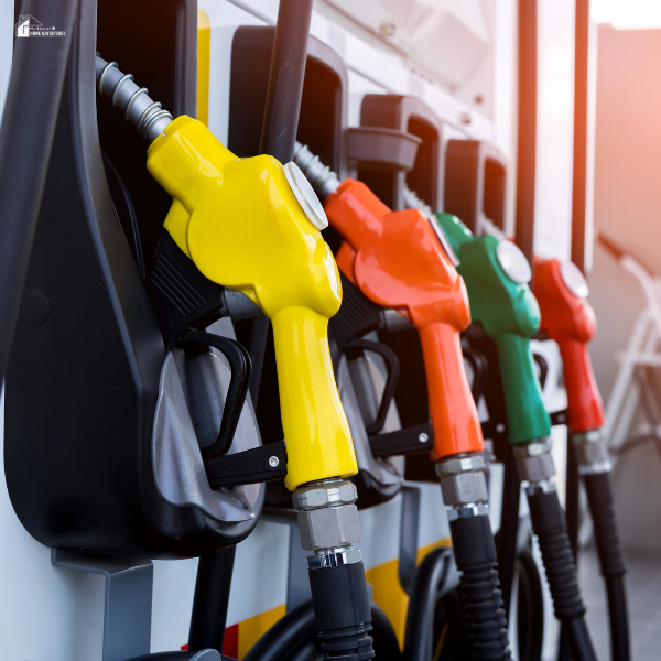 Close-up of colorful fuel nozzles organized on a gas pump.