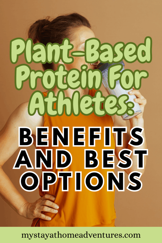 A fit woman in an orange tank top smiles while drinking a protein shake, with her hand on her hip against a tan background.