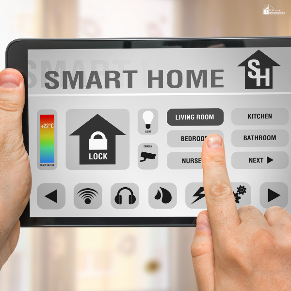 A person using a digital tablet to control smart home features like lighting, security, and temperature.