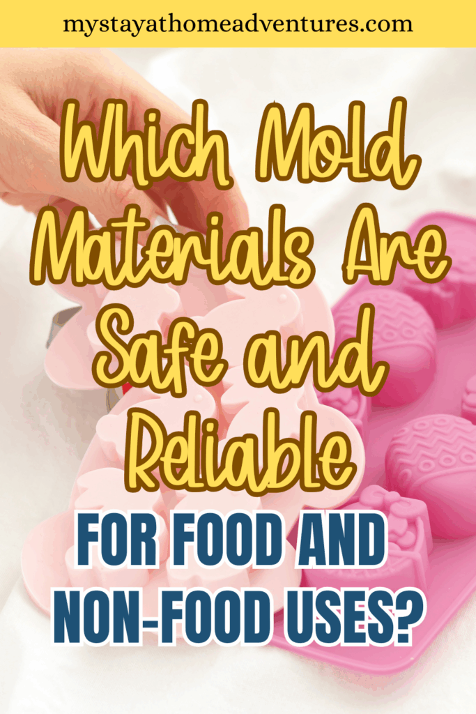 A hand placing or removing a soft pink mold filled with different shaped objects on a cloth surface.