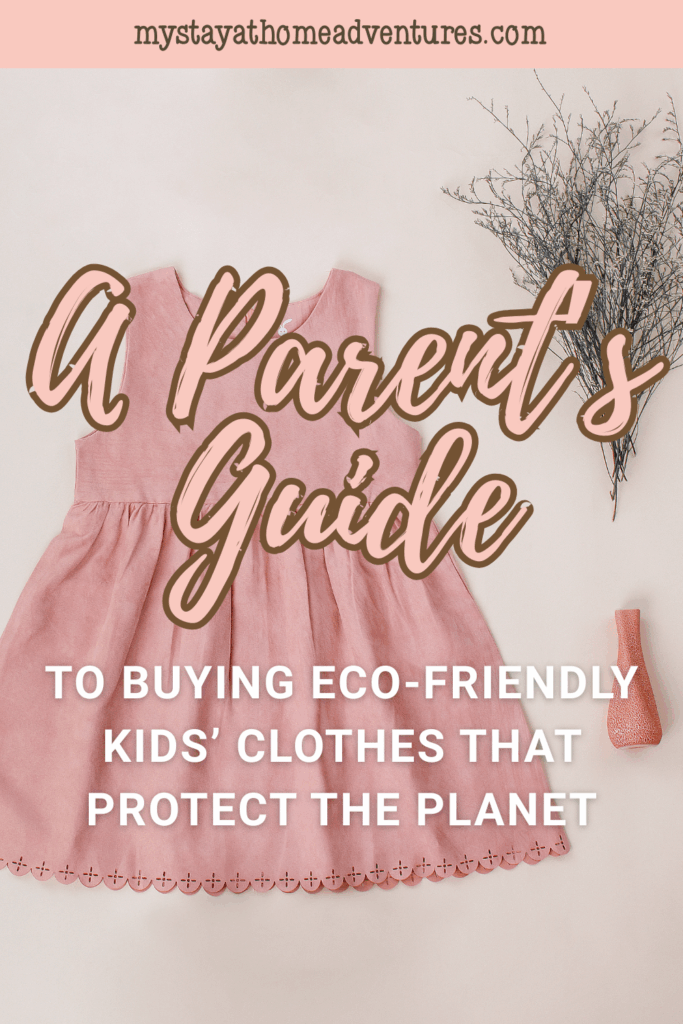 Flat lay of a pink toddler dress on a soft surface with minimalist decor, reflecting sustainable fashion for children.