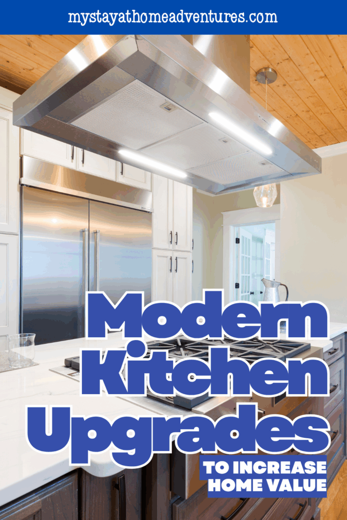 A bright, modern kitchen with stainless steel appliances, white countertops, and a large center island cooktop.