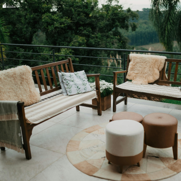 A cozy outdoor seating area with wooden benches and cushions shows how small weekend upgrades can refresh an outdoor space without hiring a contractor.