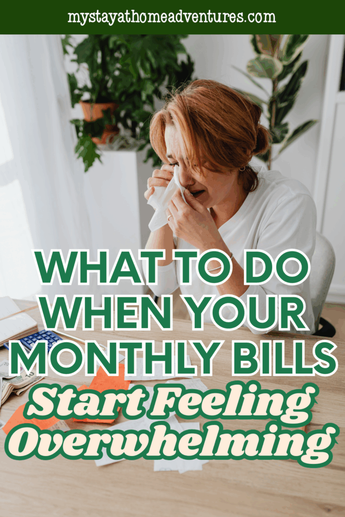 Woman sitting at a table surrounded by receipts, appearing upset while managing finances.