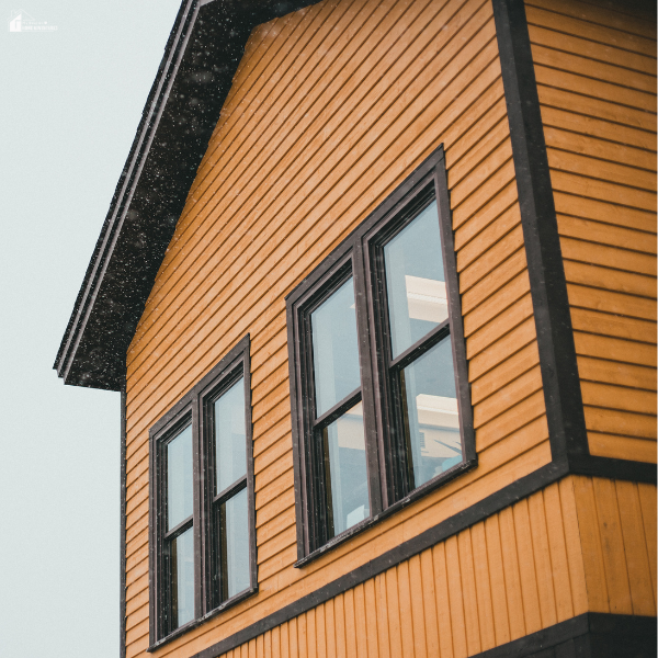 Wood siding and energy-efficient windows highlight simple exterior upgrades that help enhance insulation and year-round home comfort.