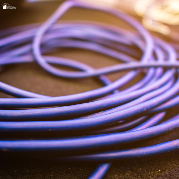 Wet or tangled electrical wires representing potential outdoor lighting problems during rainy weather.