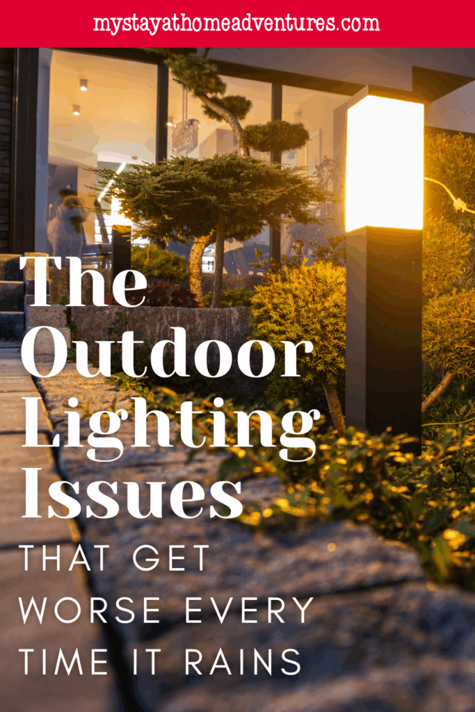 A glowing pathway light during wet weather, highlighting common outdoor lighting challenges caused by rain.