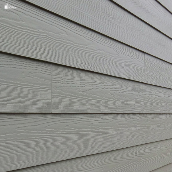A detailed view of fiber cement siding, showing a durable material option for upgrading your home's exterior.
