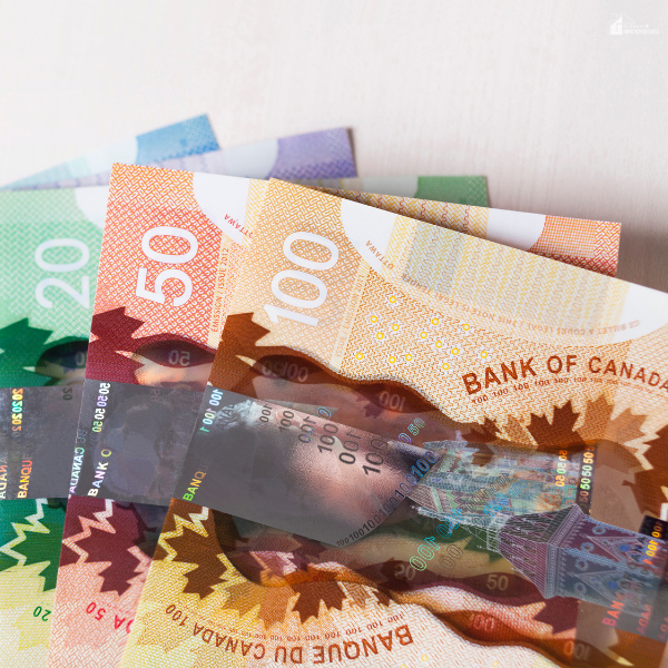 Stack of Canadian currency symbolizing key considerations in managing and relieving debt in Canada.