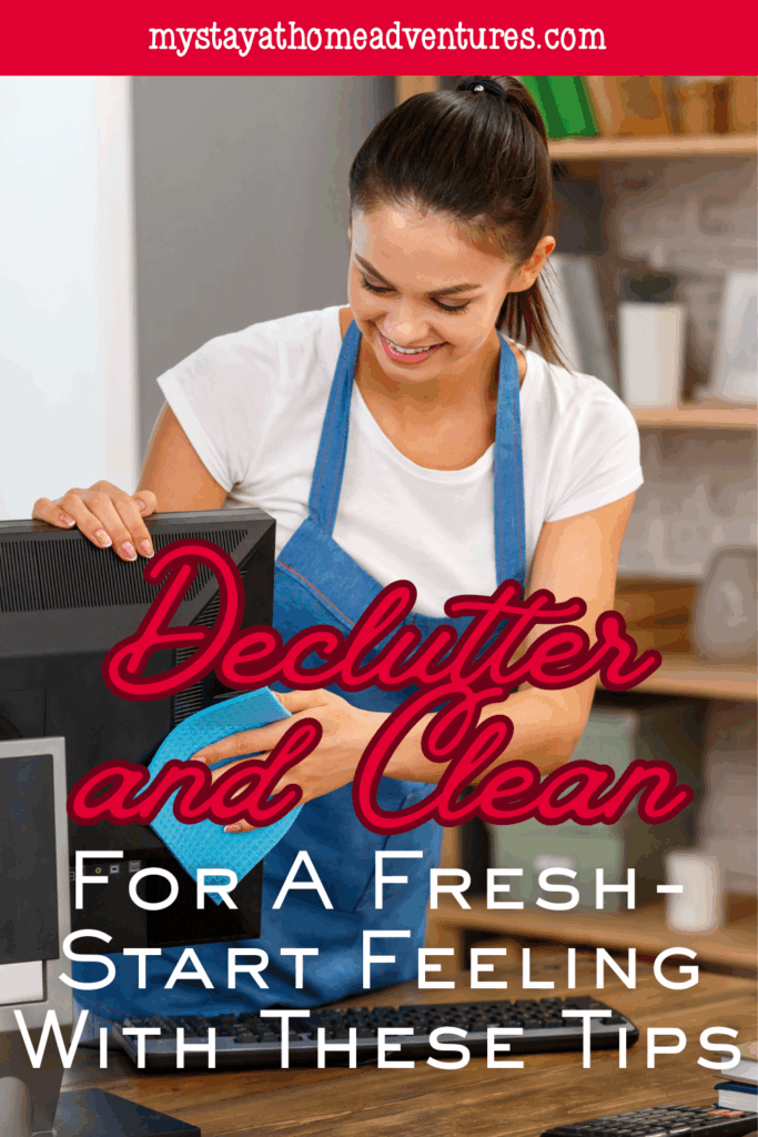 A cheerful woman wipes down her workspace, showing how decluttering supports a fresh-start mindset.