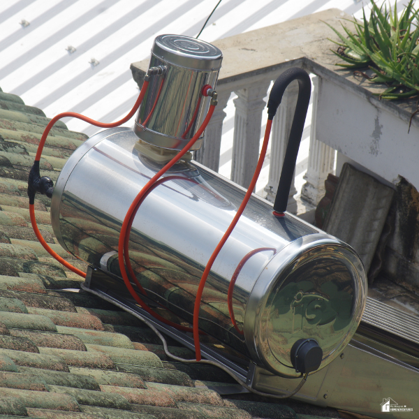 A rooftop solar water heater with red tubing illustrates a hands-on way to experiment with solar energy at home.