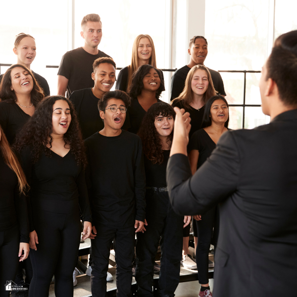 A choir rehearses in person, showing the contrast to how online tools now allow similar practices from home.