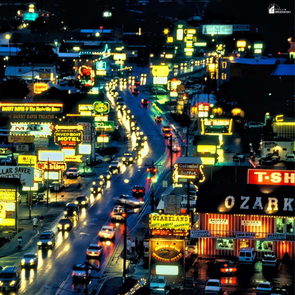 Night view of Branson’s busy entertainment strip, showing the contrast to peaceful Ozarks retreats.