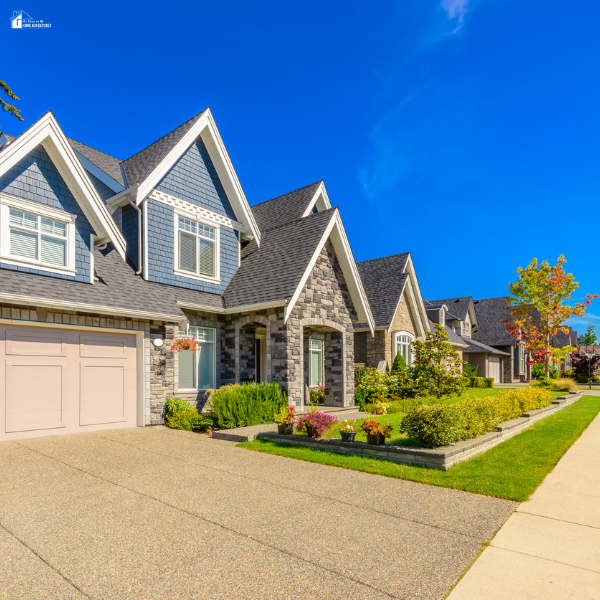 Newly constructed neighborhood of single-family houses with landscaped yards, reflecting housing development focused on long-term residents rather than vacation stays.