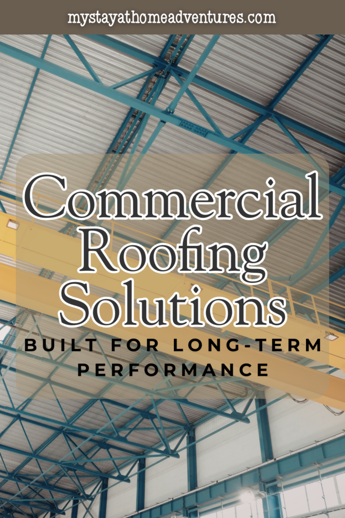 Upward view of steel framing and insulated metal roofing panels inside a commercial facility, highlighting construction built for long-term durability and efficiency.