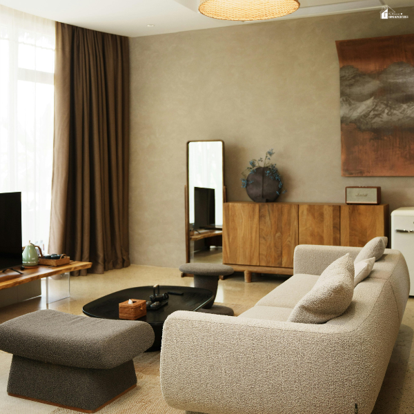 Modern living room with streamlined furniture and a sleek cabinet, highlighting built-in storage solutions that maintain an open, spacious feel.