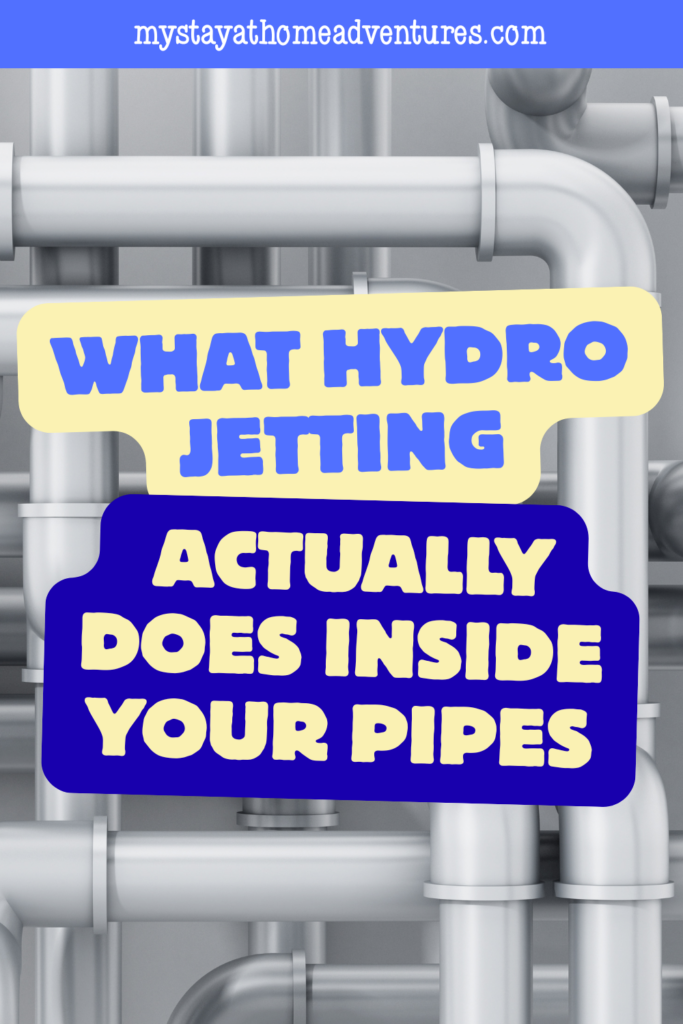A network of clean, silver pipes in the background highlights the effectiveness of hydro jetting in restoring pipe flow.